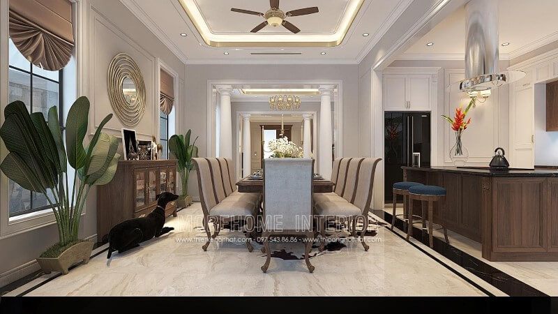 Phòng ăn được trang trí đẹp bằng bộ bàn ghế ăn gỗ óc chó bọc nỉ tân cổ điển cao cấp.