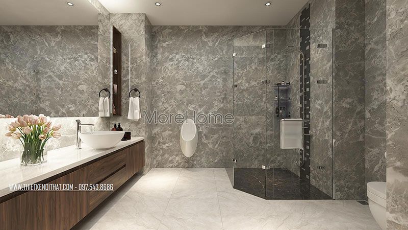 Vách kính cường lực được sử dụng để chia cách không gian vệ sinh và phòng ngủ, giúp tạo ra một không gian thoáng đãng hơn.